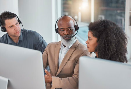 Call center, training and teaching with people in office for mentor, commitment and coaching. Advice, customer service and contact us with employee at computer for friendly, help desk and consultingの写真素材