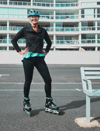 Roller skate, smile and senior woman in city ready for sports, adventure and fitness hobby outdoors. Retirement, holiday and portrait of elderly female excited for skating, travel activity and relaxの写真素材