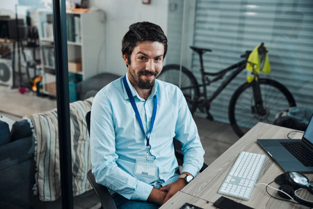 Man, portrait and IT technician in an office for computer software, technology or problem solving at...
