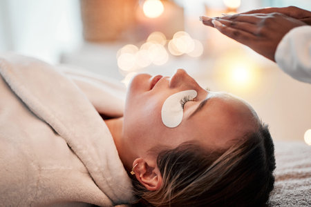 Eye pads, skincare and woman getting a facial for beauty, self care and cosmetic treatment. Health,...