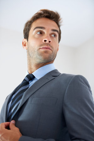 The modern professional. a handsome young businessman at work.の写真素材