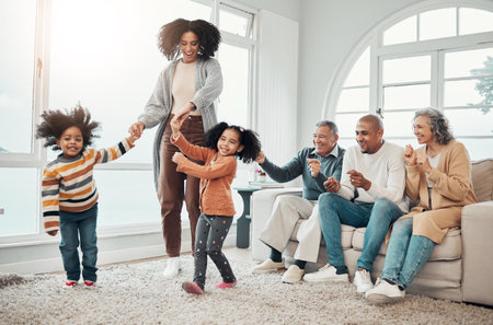 Black family, vacation and mother playing with children in a home in winter and bonding together in a house. Parents, grandparents and mom play with kid having fun in a living room on a getawayの写真素材