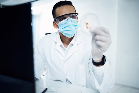 The master in making viruses disappear. a young scientist conducting medical research in a laboratory.の写真素材