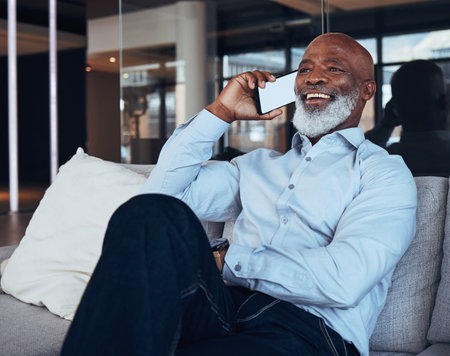 Phone mockup, call and black man laughing for business discussion, mobile cellphone or connection. Happy male worker, communication and smartphone for contact, consulting and network in office loungeの写真素材