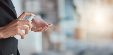 Hand sanitizer, hygiene and hands of woman with cleaning, disinfectant from germs and bacteria with health. Mockup space, closeup and clean, covid and healthcare compliance, female at work with sprayの写真素材
