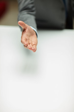 Lets build this business empire together. an unrecognizable businessman standing alone and extending...