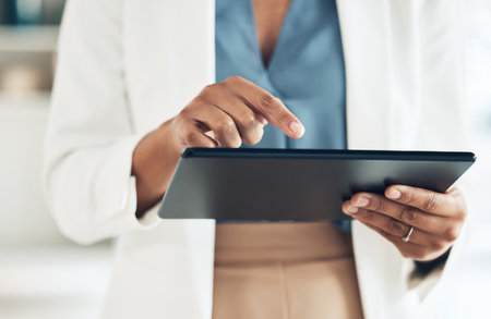 Tablet, typing and hands of woman in office for networking, information and project analysis. Executive, technology and digital with zoom of female browsing online for app, email and connectionの写真素材