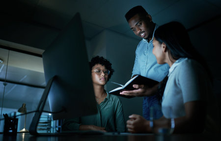 A good plan is the best preparation for success. a group of young businesspeople using a computer...