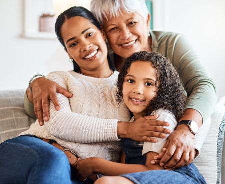 Three generations in one picture. a grandmother spending time with her daughter and grandchild at home.の写真素材