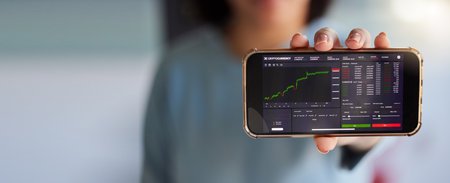 Stock market chart, screen and phone in hands of woman for crypto, trading analysis and bitcoin mockup. Fintech growth, ecommerce and girl on smartphone for financial statistics, profit app or investの写真素材