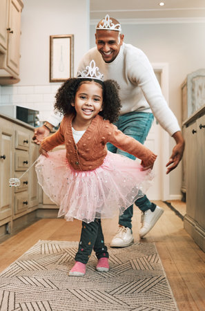 Child tutu, parent ballet dance and portrait of girl and father together bonding with dancing in the kitchen. Home, kid and dad with love and care in a house playing a dancer game for children funの写真素材