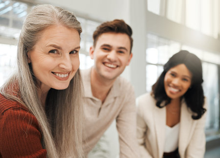 Portrait of diverse businesspeople. Group of colleagues smiling in an office. Coworkers working together. Professional entrepreneurs working in an architecture agency. Happy businesspeople in meetinの写真素材