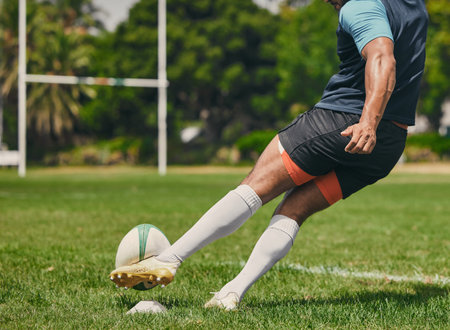Rugby, sports man or kickball in game, practice workout or training match on stadium field outdoors. Fitness body, score goals or athlete player action playing in cardio exercise on grass in Franceの写真素材