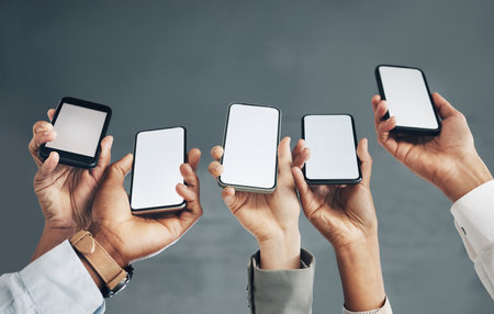 Business people, hands or phone screen on mockup space networking, advertising or digital marketing. Team of employees with online product placement on mobile application display or internet websiteの写真素材