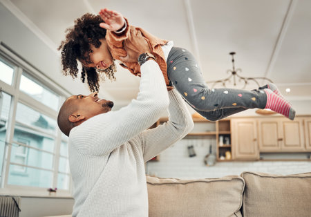 Love, father and girl in air, quality time and happiness in living room, carefree and bonding together. Family, parent and dad with female child, daughter or kid playing, airplane or loving in loungeの写真素材