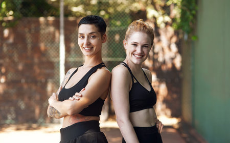 Teammates have each others backs. Cropped portrait of two attractive young female athletes standing...