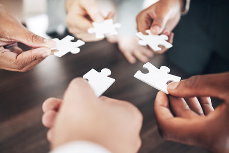 Business people, hands or puzzle for solution or problem solving with planning, teamwork or collaboration. Jigsaw, zoom or partnership support, project development ideas or community group missionの写真素材