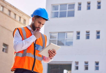 Tablet, thinking and engineering man, construction worker or building contractor contemplating or ideas for urban design. Architecture, city planning and builder inspection on digital technology appの写真素材