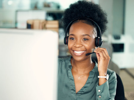 Im happy to report that the issue is now resolved. a young businesswoman wearing a headset while...