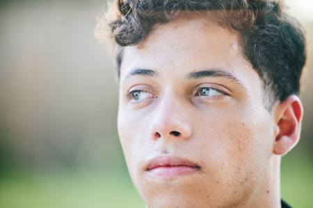 Thinking fitness, face and man in park for exercise, workout or training outdoors. Sports, serious and mindset of male athlete with idea for exercising, running or cardio for health and wellness.の写真素材