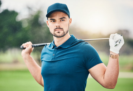 Golf, sports and man with golfing club on course for game, practice and training for competition. Professional golfer, serious face and male athlete with focus for exercise, activity and recreationの写真素材