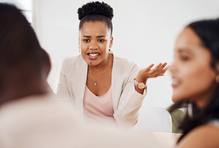 Its still not making any sense to me...a young businesswoman having a meeting with her colleagues in an office.の写真素材
