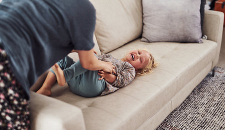 I love to hear her laugh every day. an adorable little girl bonding with her mother during a day at home.の写真素材