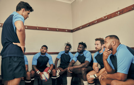 Locker room, motivation and rugby team with coach or captain in strategy discussion or game plan. Training, coaching and group of sports players planning teamwork with leader in cloakroom together.の写真素材