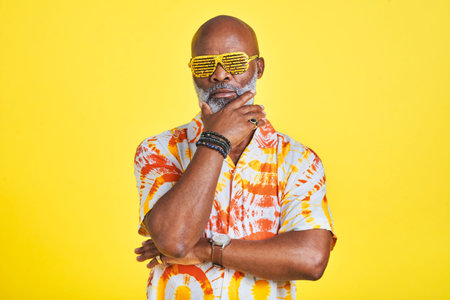 I can teach you a thing or two about being cool. Portrait of a funky and stylish senior man wearing...
