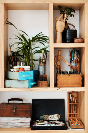 All your necessities are right here. a neatly arranged shelf in an empty art studio during the day.の写真素材