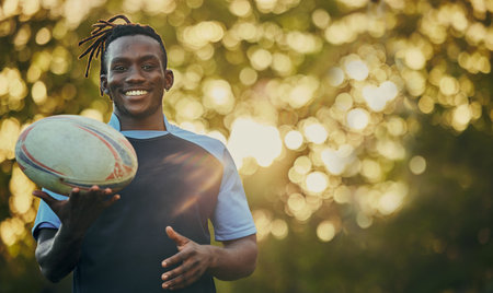Rugby, ball and portrait of black man with smile, confidence and pride in winning game. Fitness, sports and happy face of player ready for match, workout or competition at stadium with mockup space.の写真素材