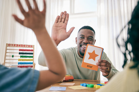 Learning, high five and father with children for homework, school activity and learning shapes at...