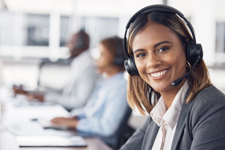 Woman, call center and portrait smile with headset for telemarketing, customer service or support at office desk. Happy female consultant or agent smiling with headphones for online advice or helpの写真素材