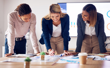 Planning, strategy and business people in meeting with teamwork, documents and report on data analytics. Market research, graph and charts analysis of corporate women, man or employees brainstormingの写真素材
