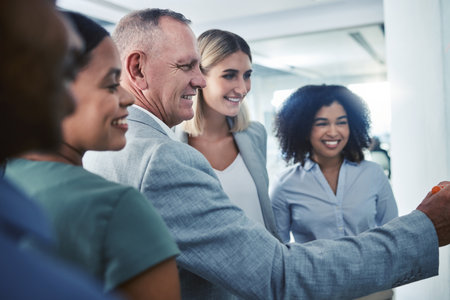 Business coaching, businessman and presentation mentor leadership in business meeting for teamwork. Happy, smile or motivation in global company strategy, kpi data analysis and collaboration trainingの写真素材