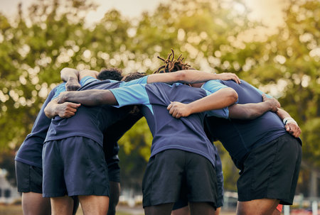 Diversity, team and men huddle in sports for support, motivation or goals outdoors. Man sport group and rugby scrum together for fitness, teamwork or success in collaboration before match or gameの写真素材