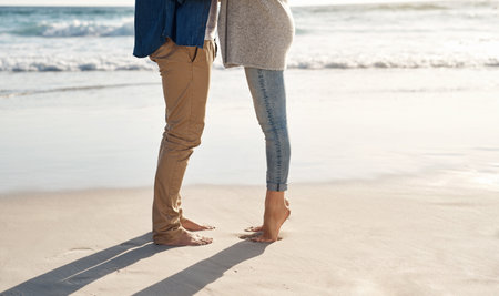 Theres no better place to fall in love. an unrecognizable couple spending quality time together on the beach.の写真素材