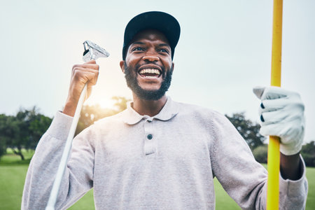 Golf, winner and happy with black man on field for training, sports and success in club. Competition, games and celebration with golfer playing on grass lawn for energy, pride and achievementの写真素材