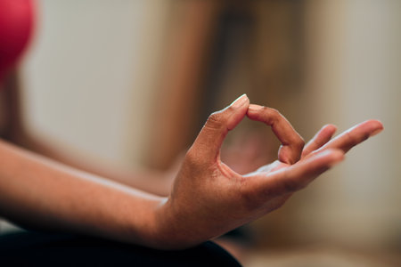 Get into lotus and let it go. a woman meditating at home.の写真素材