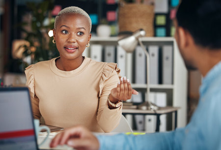 Black woman, conversation and talking business people, office friends or partnership team consulting on project. Communication, collaboration and employees speaking, chat and discussion on strategyの写真素材