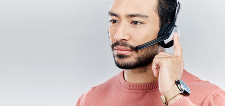 Headset, support and a man for a call center with mockup isolated on white background. Contact us,...