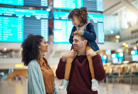 Family, airport and travel with a girl child sitting on the shoulders of her father in a terminal for a holiday flight. Immigration, kids or diversity with a mother, dad and daughter traveling aboradの写真素材