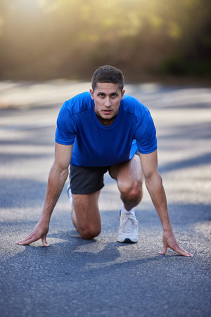 Running start, street and exercise of a man doing race training, workout and sport outdoor. Focus,...