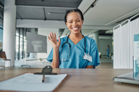 Portrait, black woman and doctor greeting, hospital and smile with success, medicine development and confidence. Face, African American female and medical professional with wave, healthcare and happyの写真素材