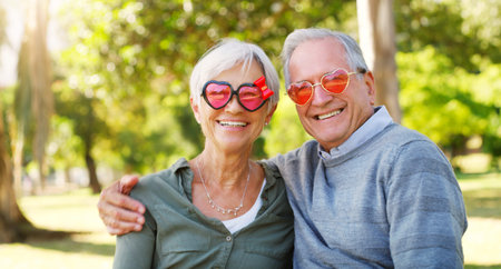 Grey haired but young in spirit. Cropped portrait of an affectionate senior couple relaxing together...