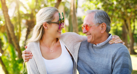 Nothing changes a fathers love for his daughter. a happy senior man spending time with his daughter at the park.の写真素材