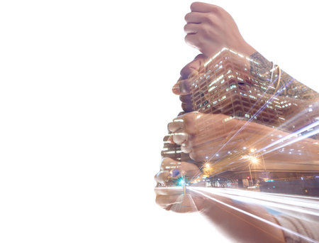 Hand fist, city overlay and business people together in solidarity, community support on studio team building. Collaboration mockup, architecture teamwork and group power isolated on white backgroundの写真素材