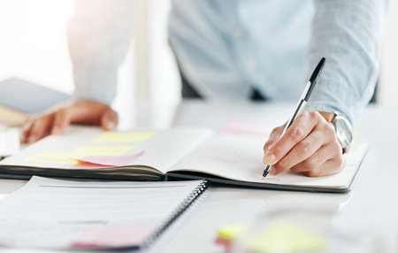 Closeup, hands and notebook for ideas, planning and feedback for review, brainstorming and...
