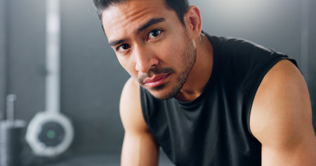 Gym motivation, determination and man focus on fitness, exercise and training performance for health, wellness and strong body. Determined mindset, commitment and athlete ready for workout challengeの写真素材