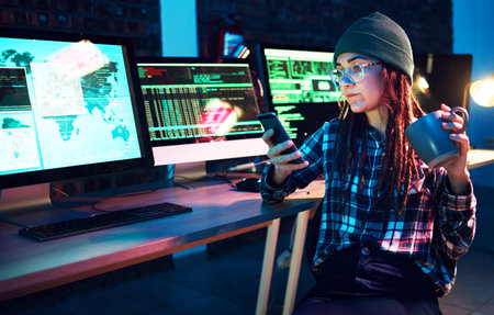 Phone, cyber security or woman by computer screen in dark room at night for coding, phishing or blockchain. Coffee, programmer ux or girl hacking online in digital transformation on global websiteの写真素材